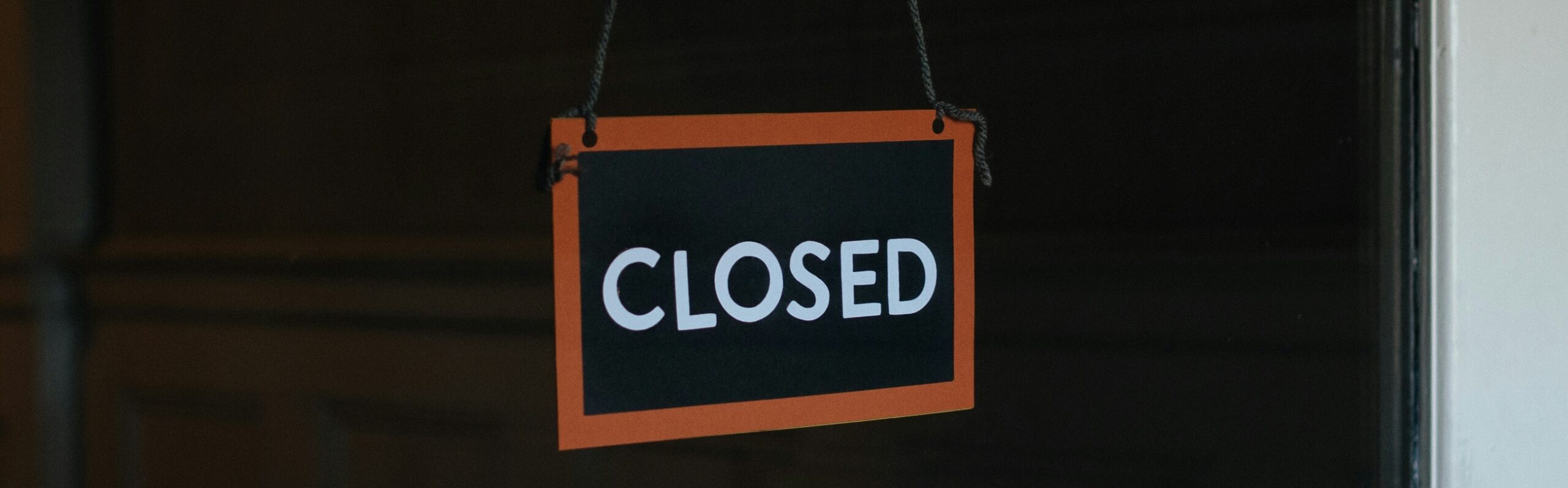 A closed sign representing a suspended Google Business Profile